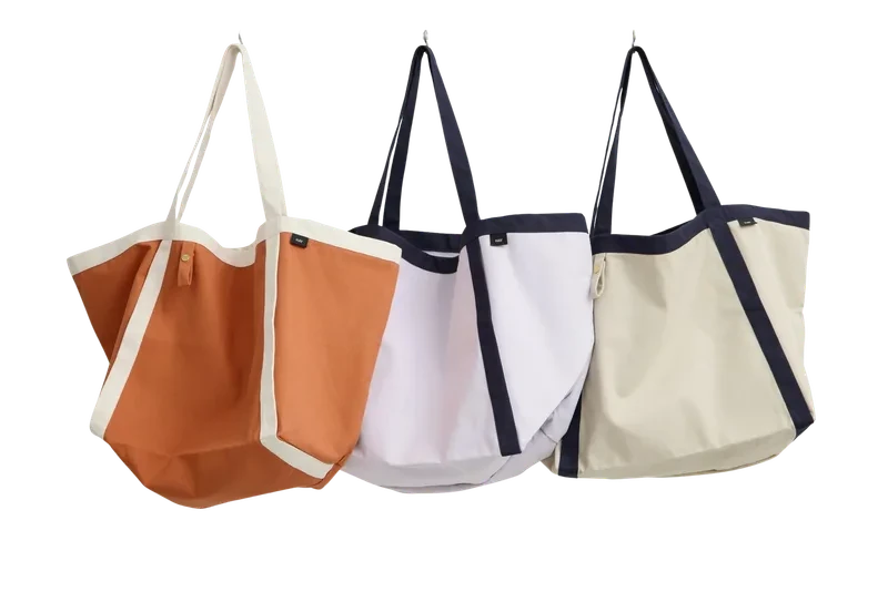 Color-blocked canvas tote bags crafted from sustainable ReWeav fabric