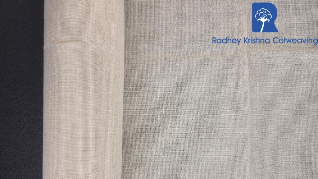 Raw cotton fabric rolls stacked